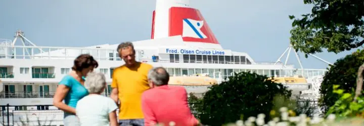 Guests Standing Next to Fred. Olsen Ship