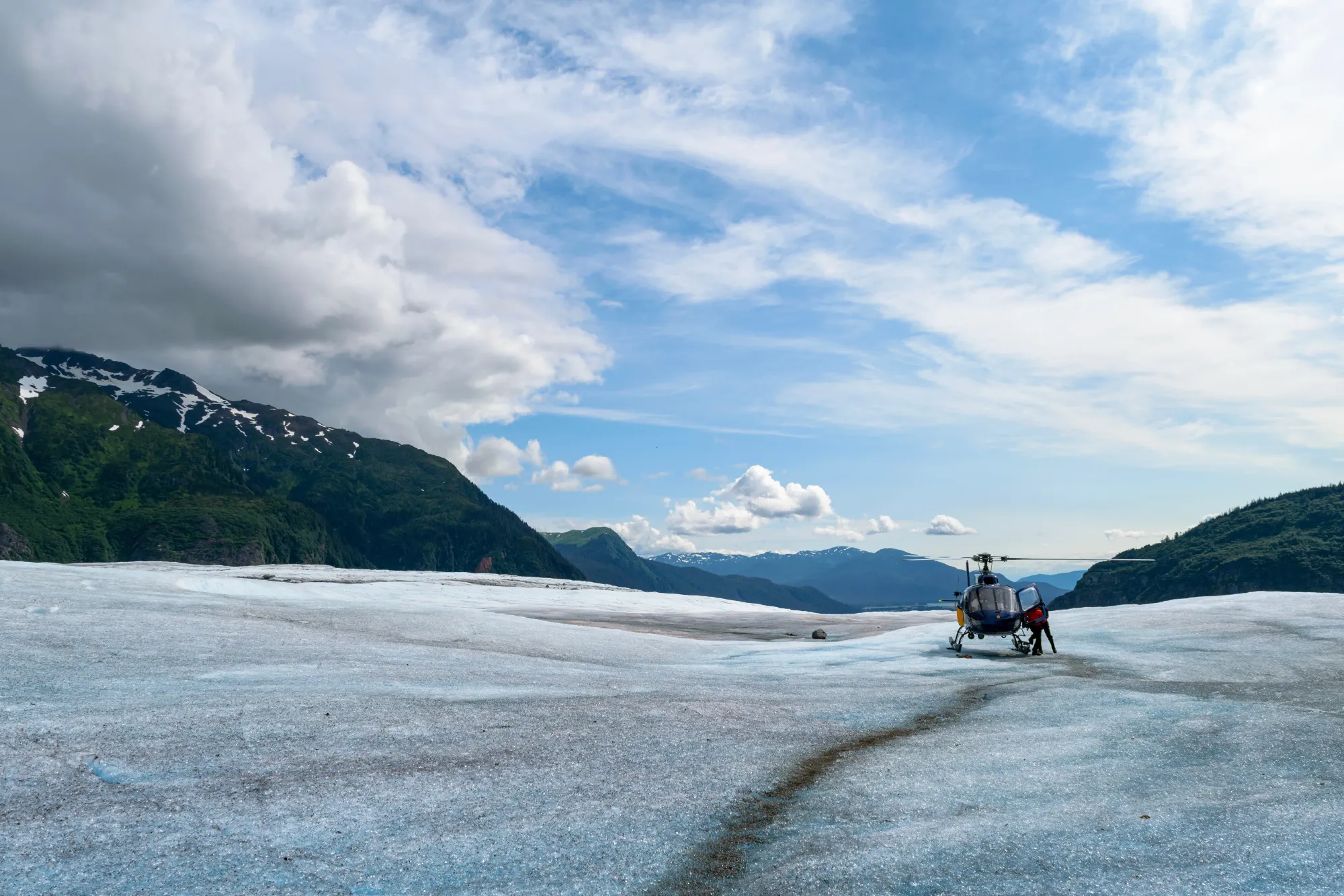 Helicopter landing on glacier