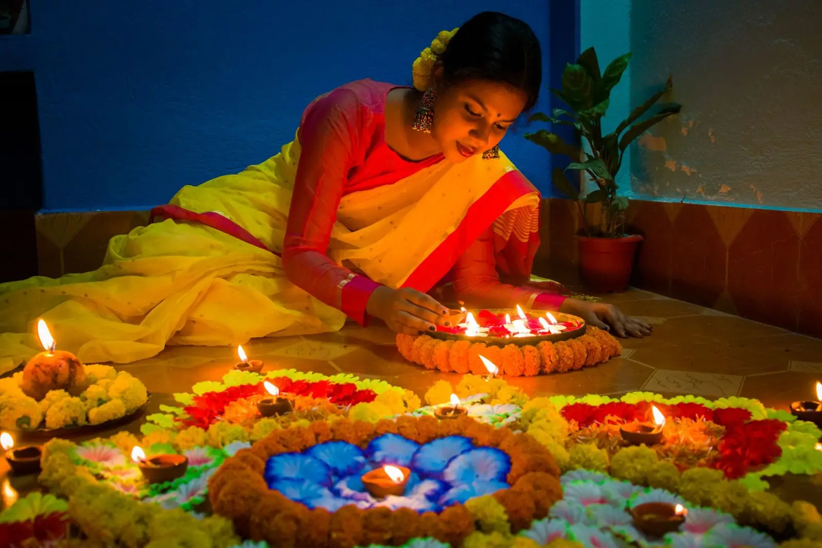 Lady lighting candles for Diwali 
