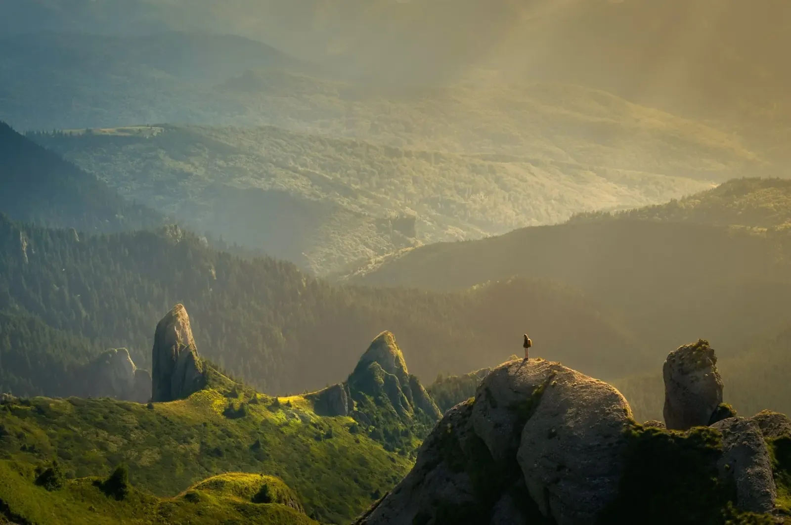 Person surrounded by mountains