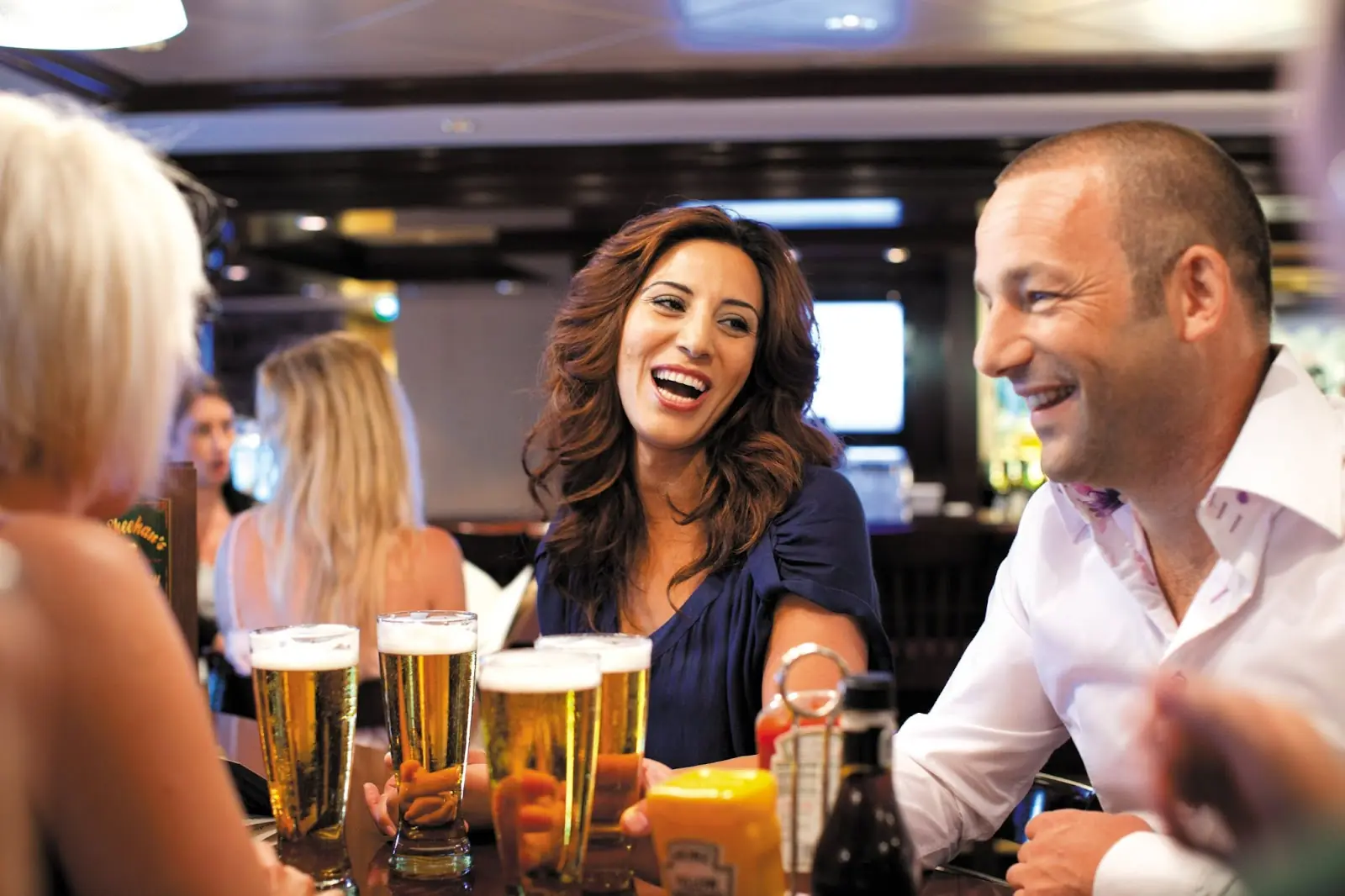 Guests enjoying beer at a NCL bar