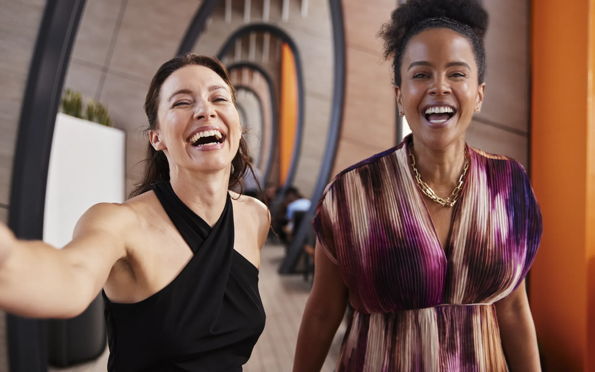 Two women laughing on a Celebrity Cruises cruise ship