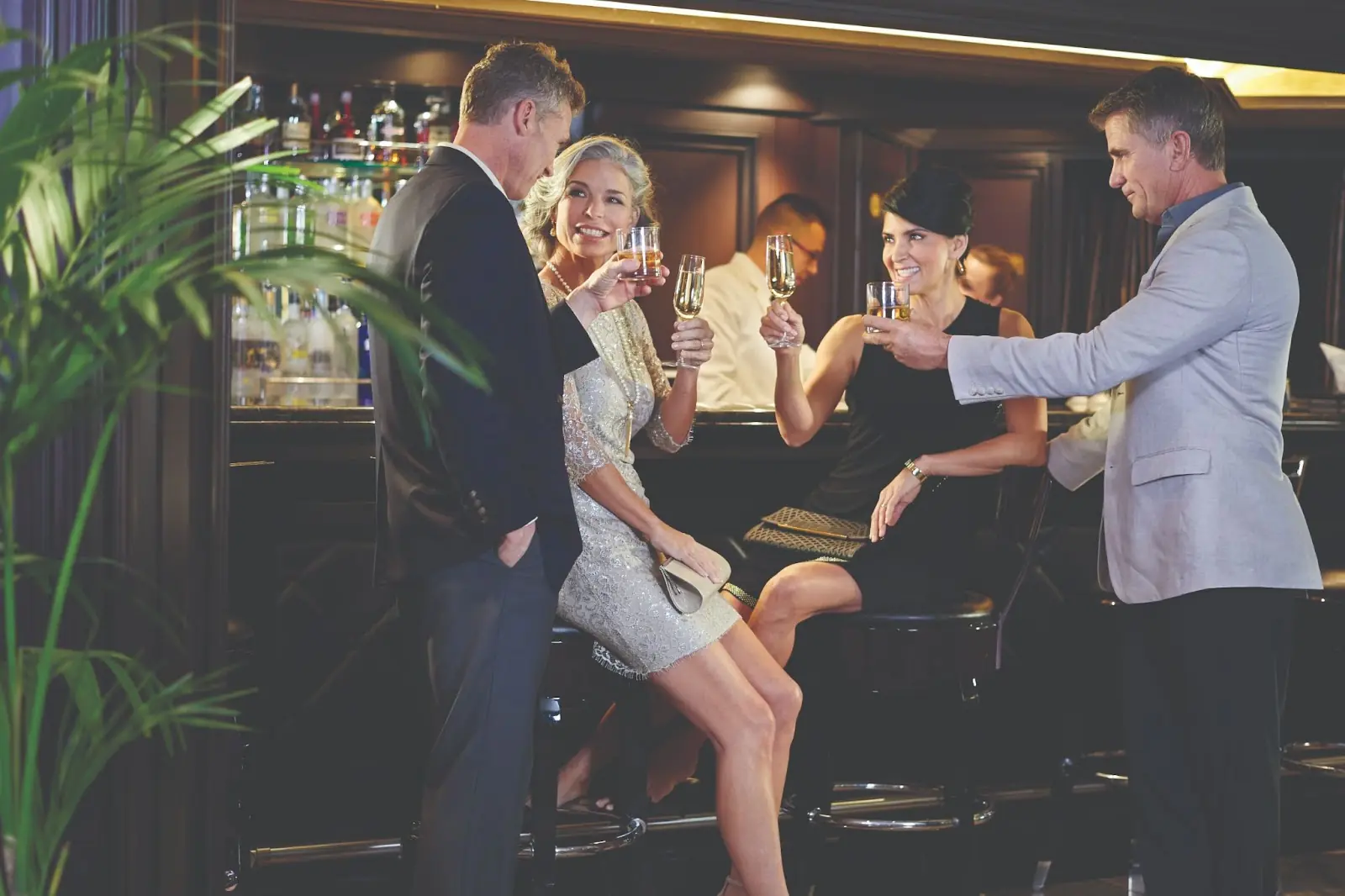 Guests at a bar onboard Oceania Cruises