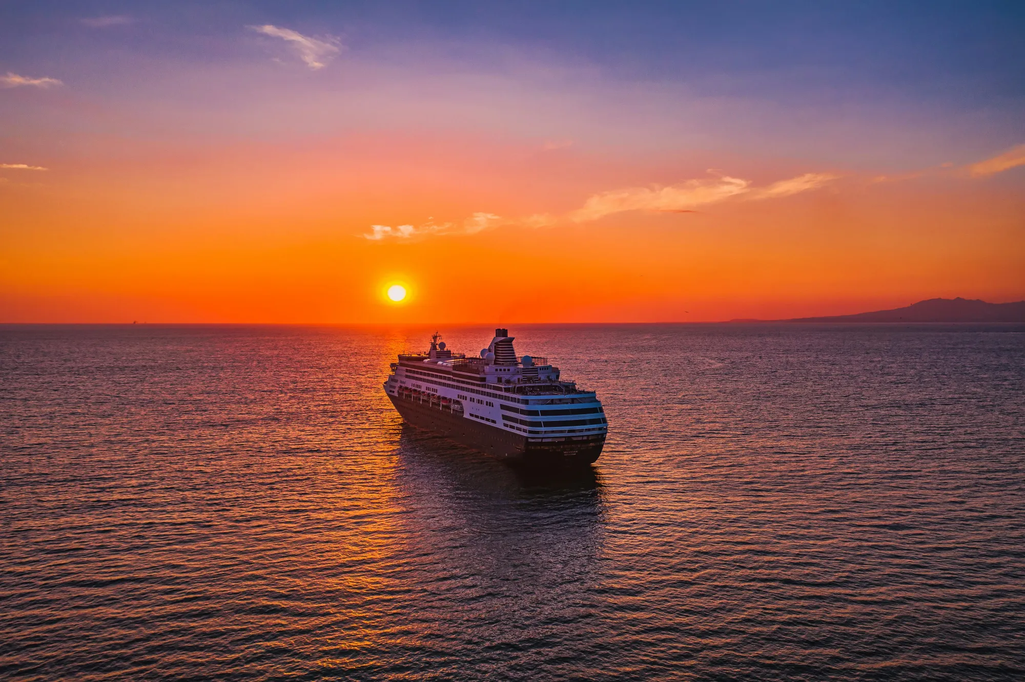 Cruise ship sailing off into the sunset