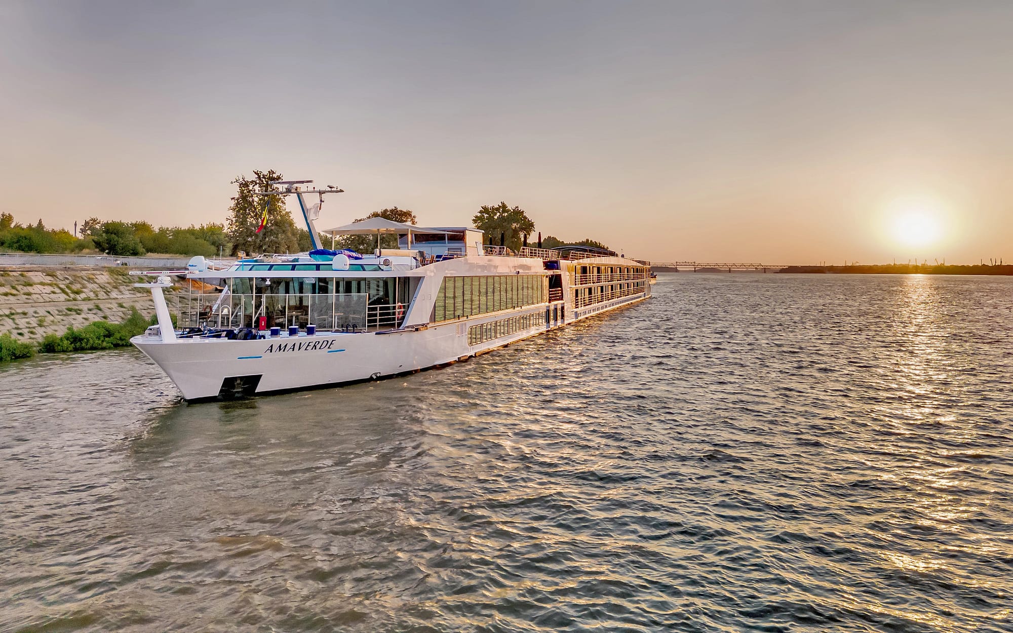 A river cruise ship on the Danube river during sunset
