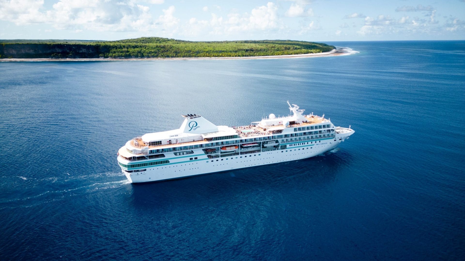 An image of a cruise ship in calm waters around French Polynesia